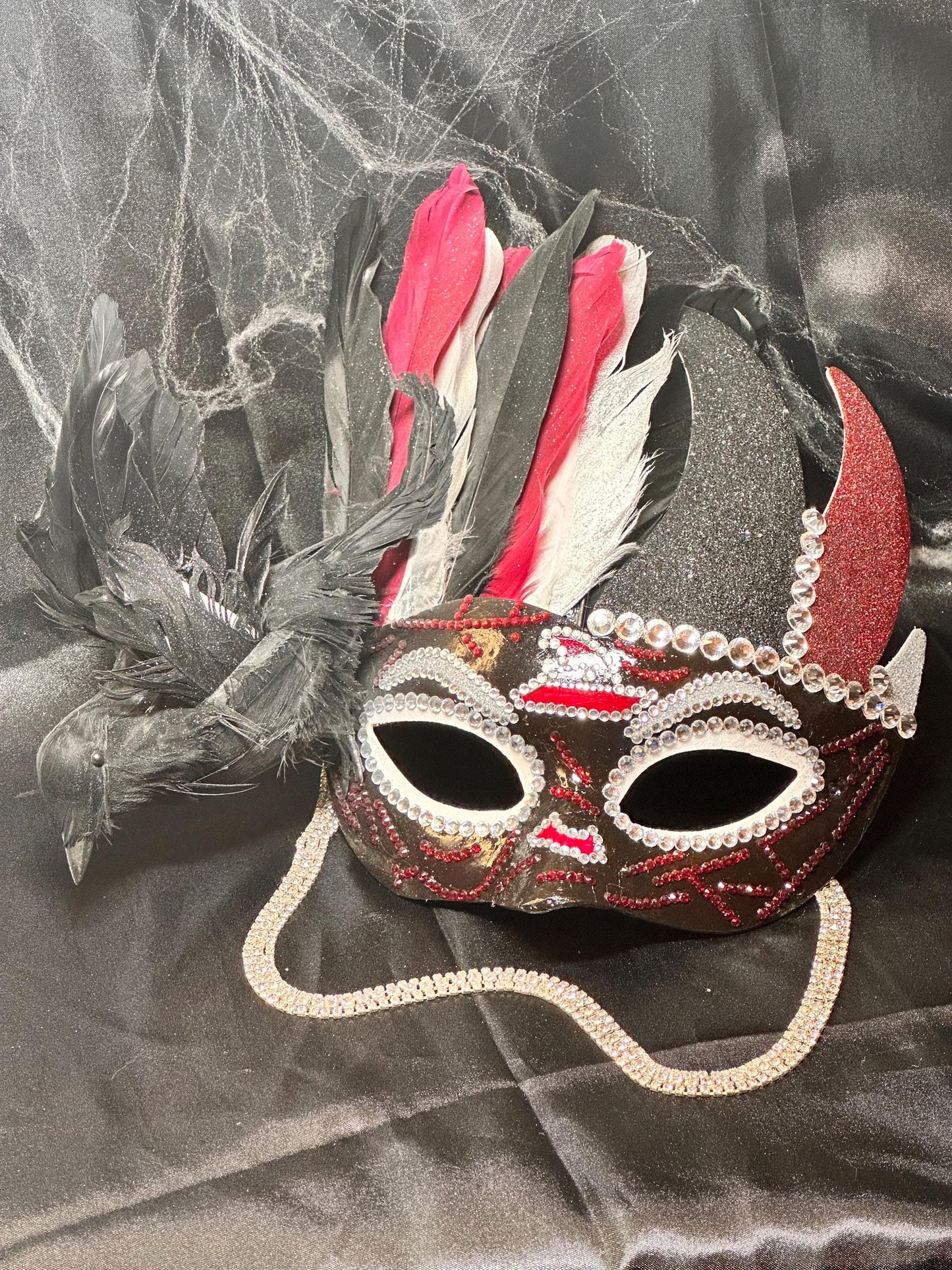Feathered mask: The Witch’s Coven