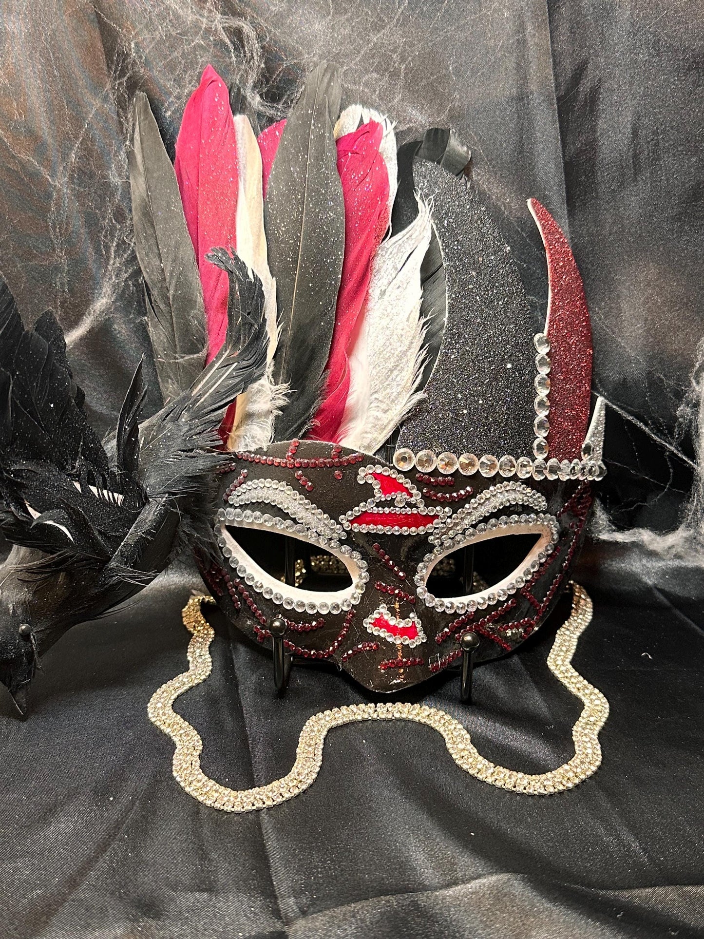 Feathered mask: The Witch’s Coven